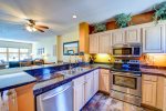 Spacious kitchen with view of living room in a Lakeside Village condo